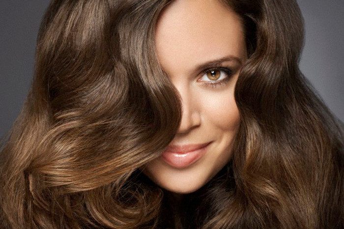 Woman with wavy hair --- Image by © Ada Summer/Corbis