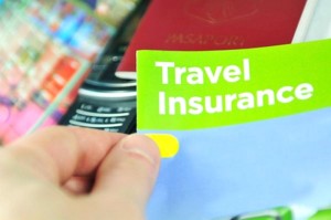 Travel insurance concept with hand holding information leaflet